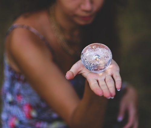 Woman Holding Crystal Ball